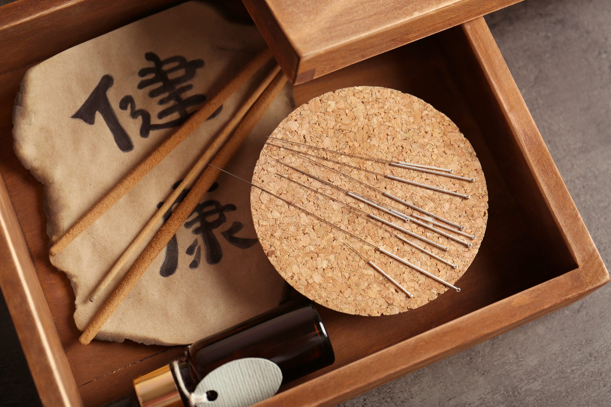 professional-wooden-box-with-needles-tools-acupuncture-procedure-scaled